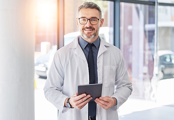 Image showing Tablet, doctor and smile with portrait of man in hospital for consulting, digital and telehealth. Communication, medicine and healthcare with person in clinic for search, wellness and lens flare