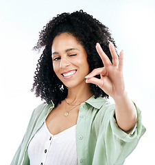 Image showing Wink, studio and woman portrait with perfect hand sign for support or agree, vote or review on white background. Face, smile and emoji yes by lady with ok, approval or like, thank you or feedback