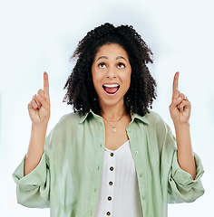 Image showing Pointing up, surprise or happy woman excited by sale, retail offer or discount deal isolated in studio. Wow, advertising or shocked girl with mockup space, news or menu promotion on white background