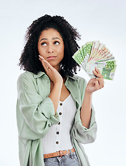 Image showing Woman, money fan and thinking in studio for prize, profit or bonus from investing, savings or notes by white background. Isolated African girl, student and decision for cash, win or gambling in lotto