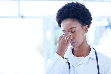 Image showing Headache, doctor and stress with black woman at the hospital, clinic or working with burnout, fatigue or pain in head. Frustrated, person and problem with mental health, healthcare or migraine