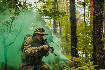 Image showing Battle of the military in the war. Military troops in the smoke