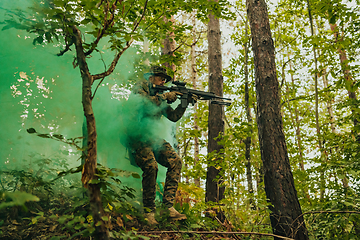 Image showing Battle of the military in the war. Military troops in the smoke