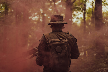 Image showing Battle of the military in the war. Military troops in the smoke