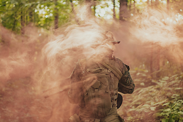 Image showing Battle of the military in the war. Military troops in the smoke