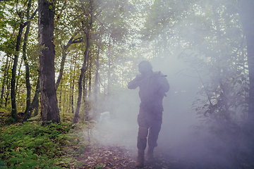 Image showing Battle of the military in the war. Military troops in the smoke