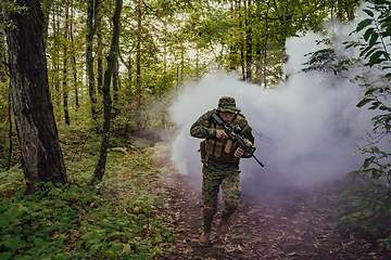 Image showing Battle of the military in the war. Military troops in the smoke