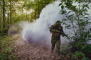 Image showing Battle of the military in the war. Military troops in the smoke