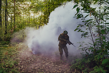 Image showing Battle of the military in the war. Military troops in the smoke