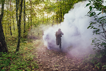 Image showing Battle of the military in the war. Military troops in the smoke