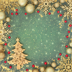 Image showing Christmas Tree Holly Berry and Gold Bauble Background 
