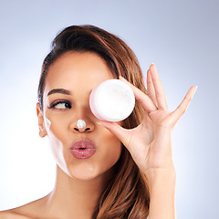 Image showing Beauty, skincare cream or woman with sunscreen product in daily grooming treatment with makeup cosmetics. Dermatology, white background or girl model applying facial creme or face lotion in studio