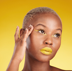 Image showing Thinking, creative makeup and black woman with skincare, cosmetics and dermatology on a yellow studio background. Female person, fantasy and model with facial, beauty and aesthetic with self care