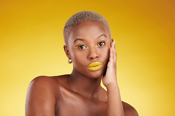 Image showing Creative, makeup and portrait with african girl for glow in yellow studio, background or luxury spa. Serious, cosmetics and woman with art on face for aesthetic with beauty or wellness with eyeliner.