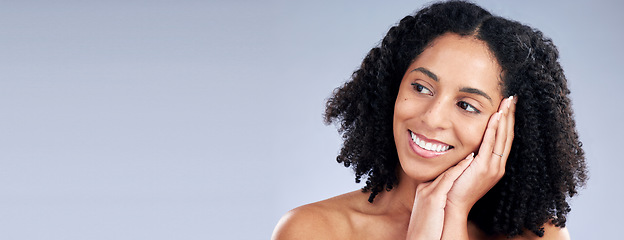 Image showing Face, beauty and mockup with a woman thinking in studio on a gray background banner for skincare. Smile, idea and space with a young female model advertising or marketing luxury wellness or treatment