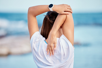 Image showing Woman, fitness and back on beach in stretching, workout or getting ready for exercise or outdoor training. Rear view of sports female person in body warm up, preparation or healthy wellness by ocean