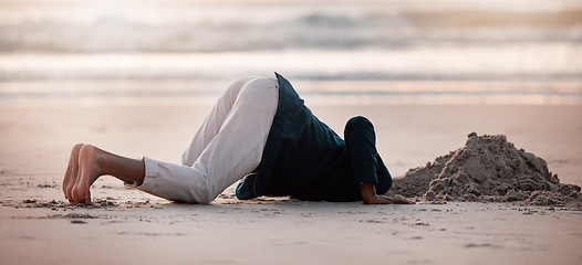 Image showing Search, digging and a man in the beach sand in nature for travel fun or holiday adventure in summer. Earth, looking and a person with a check in the ground at the ocean for treasure on vacation