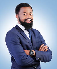 Image showing Smile, confidence and portrait of businessman with crossed arms in a studio with success and leadership. Smile, professional and headshot of young, male and African lawyer isolated by blue background