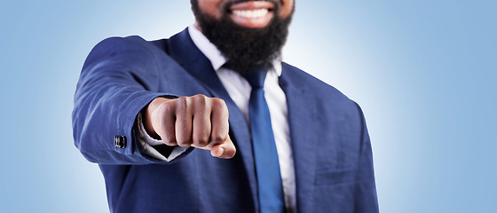 Image showing Businessman, hands and fist bump for meeting or partnership on banner against a blue studio background. Closeup of man touching for business deal, approval or success in agreement, unity or teamwork