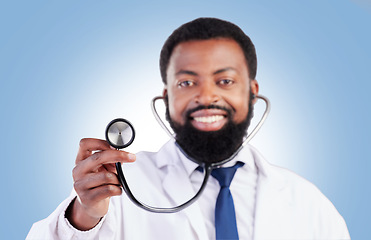 Image showing Stethoscope, portrait and man doctor in studio with cardiovascular, exam or promo deal on blue background. Heart, health and African guy surgeon with medical tool for heartbeat, lung and breath check