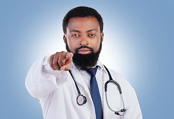 Image showing Doctor, hand and black man portrait in studio with offer, deal and promo or announcement on blue background. Face, choice and African male healthcare expert with advice, questions or coming soon news