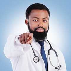 Image showing Black man, portrait and doctor pointing to you for healthcare selection against a blue studio background. Face of African male person or medical professional in decision or choice for clinic checkup