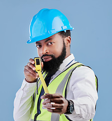 Image showing Black man, portrait and architect with measuring tape for construction against a blue studio background. Face of African male person, engineer or contractor in architecture planning with measure tool