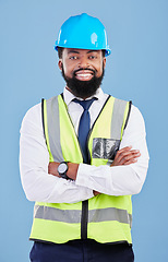 Image showing Happy black man, portrait and engineering with arms crossed in studio for safety inspection, maintenance and construction. Architect manager, contractor and industrial technician on blue background