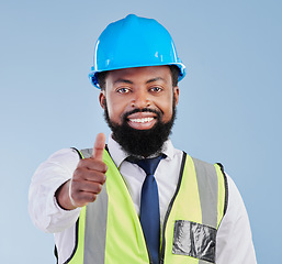 Image showing Portrait, engineering and black man with thumbs up for success, thank you or support of architect in studio. Happy project manager, hand emoji and yes for winning construction deal on blue background