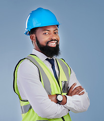 Image showing Construction, black man and portrait with arms crossed in studio for building inspection, engineering or industrial development. Happy male architect, contractor or project manager on blue background