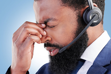 Image showing Customer service face, studio black man and sad over consultation mistake, help desk problem or telemarketing burnout. Mental health, call center fail and African person depressed on blue background