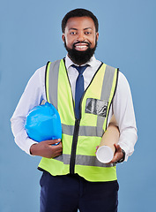 Image showing Happy black man, portrait and construction blueprint in studio for safety inspection, maintenance or architecture. Engineering, contractor and industrial manager with building plan on blue background