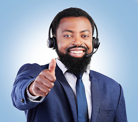 Image showing Customer support portrait, happy black man and thumbs up for telecom studio advice, thank you or sales pitch agreement. E commerce vote icon, emoji yes sign and African person face on blue background