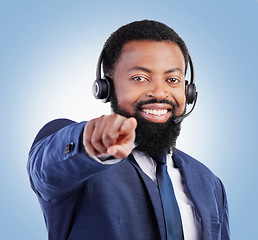 Image showing Customer support portrait, happy black man and pointing at you, telecom choice, promotion decision or ecommerce vote. Studio face, call center consultant and African person gesture on blue background