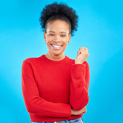 Image showing Studio, portrait and black woman with a smile, natural beauty and confidence with afro, fashion or thinking with hand or gesture. Blue background, African girl and mindset for goals or happiness