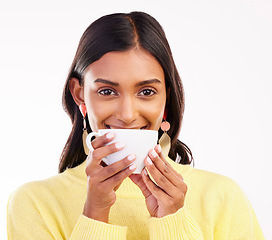 Image showing Woman, coffee and smile in studio portrait for fashion, relax or drink for health, energy or aroma by white background. Gen z girl, happy student and cup by face for coco, matcha or espresso in hands