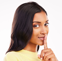 Image showing Woman, secret and studio portrait with finger, lips and smile for deal, sale or discount promo by white background. Girl, student and face with hush, sign or emoji by mouth for gossip, story or news