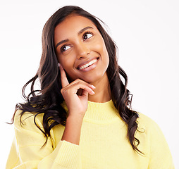 Image showing Face, thinking and smile with an indian woman in studio on white background to remember or consider. Idea, decision or nostalgia with a happy young female person daydreaming while looking thoughtful