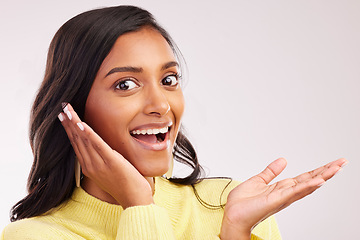 Image showing Excited, wow and portrait of a woman on a studio background with mockup for marketing. Happy, amazed and face of a girl or model with a gesture, surprise and space for a deal or announcement