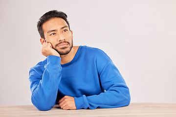 Image showing Confused, thinking and space with man and idea in studio for why, brainstorming and question. Doubt, solution and choice with asian person on white background for decision, opportunity and mockup