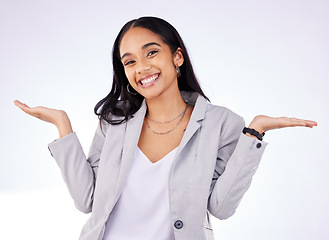 Image showing Happy, shrug and portrait of a businesswoman in a studio with a choice, decision or option expression. Smile, happiness and professional female model with a dont know hand gesture by gray background.