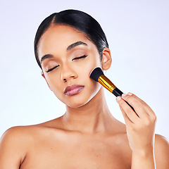 Image showing Makeup brush, beauty and cosmetics of a happy woman in studio for skincare, self care and cosmetology. Skin glow, shine and wellness of a female model with facial application tools for foundation