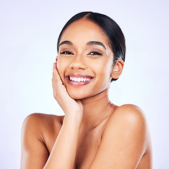 Image showing Portrait, aesthetic and skincare with a model woman in studio on a white background for natural wellness. Face, smile and beauty with a happy young person posing for luxury cosmetics or dermatology