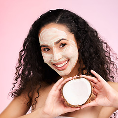 Image showing Beauty, facial mask and portrait of woman with coconut for wellness, skincare and cosmetics on pink background. Dermatology, fruit and female person for organic detox, natural face and glow in studio