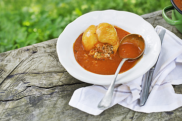 Image showing Stuffed peppers in tomato sauce