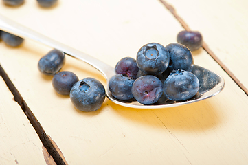 Image showing fresh blueberry on silver spoon