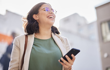 Image showing Phone, walking and happy woman outdoor in a city with communication, internet connection and app. Laugh, professional person and urban road with smartphone for message, chat or social media on travel