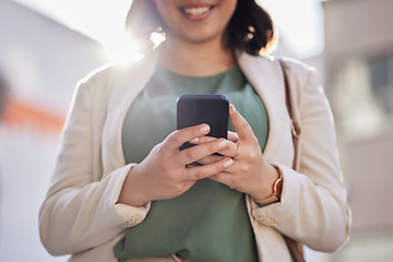 Image showing Phone, hands and a woman outdoor in a city with communication, internet connection and app. Closeup of a business person, urban town and a smartphone while typing a message or chat on social media