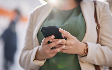 Image showing Person, hands and a phone outdoor for communication, internet connection and mobile app. Closeup of a business woman, urban town and a smartphone while typing a message or chat on social media