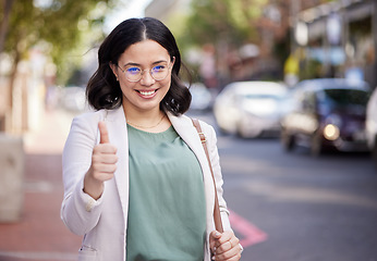 Image showing Thumbs up, portrait and business woman in the city, street or professional worker with success, agreement or thank you. Hand, sign and happy worker in urban, town or walking to office building